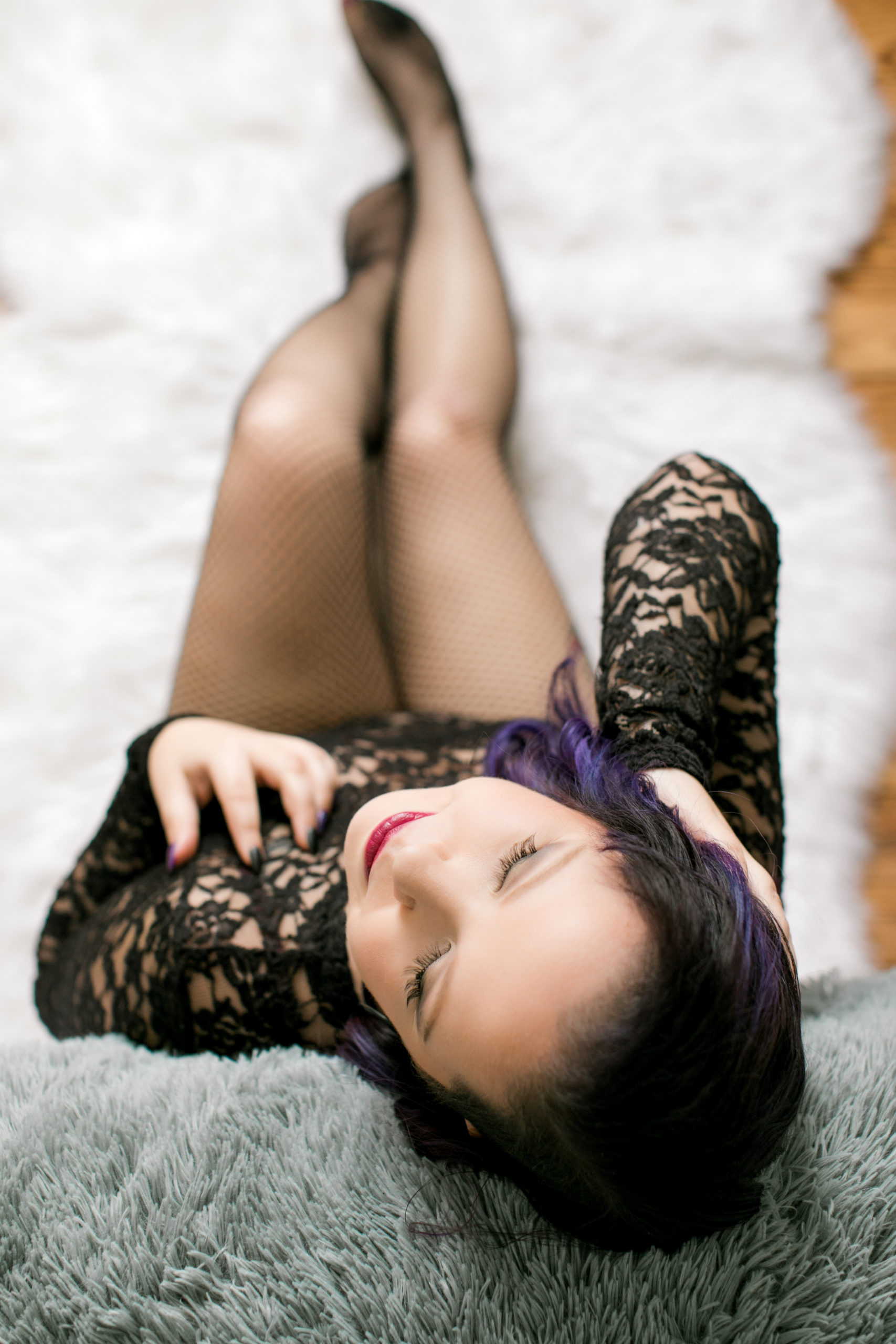 Photo of boudoir model with purple highlights in her hair