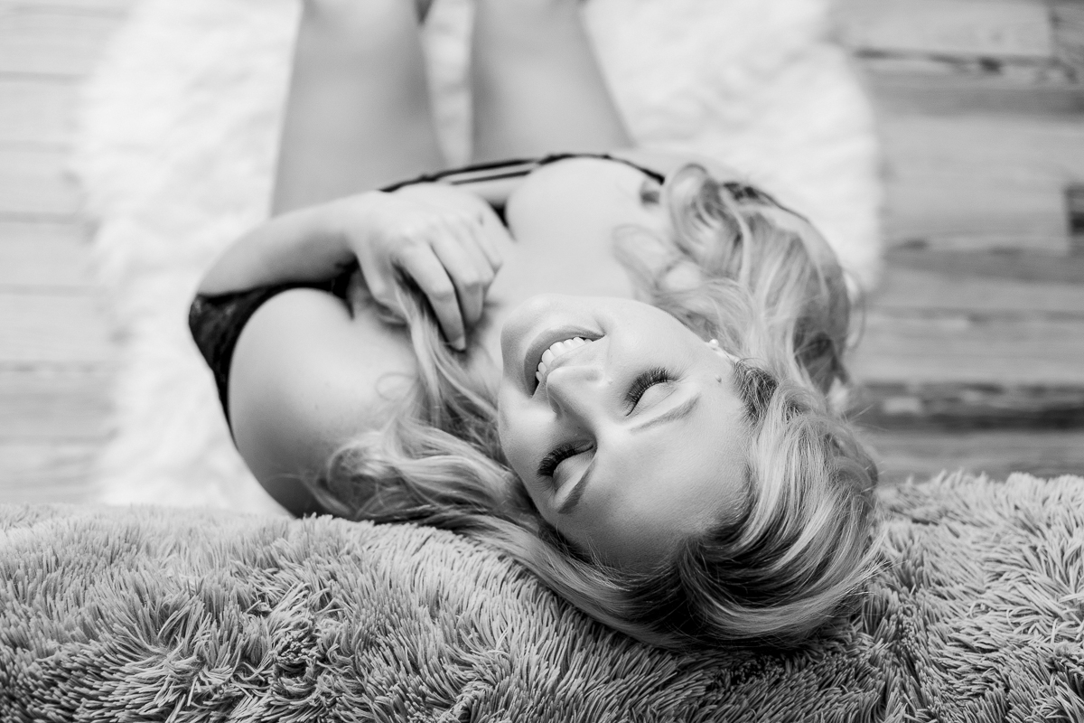 Black and white photo of Beauty C at boudoir session