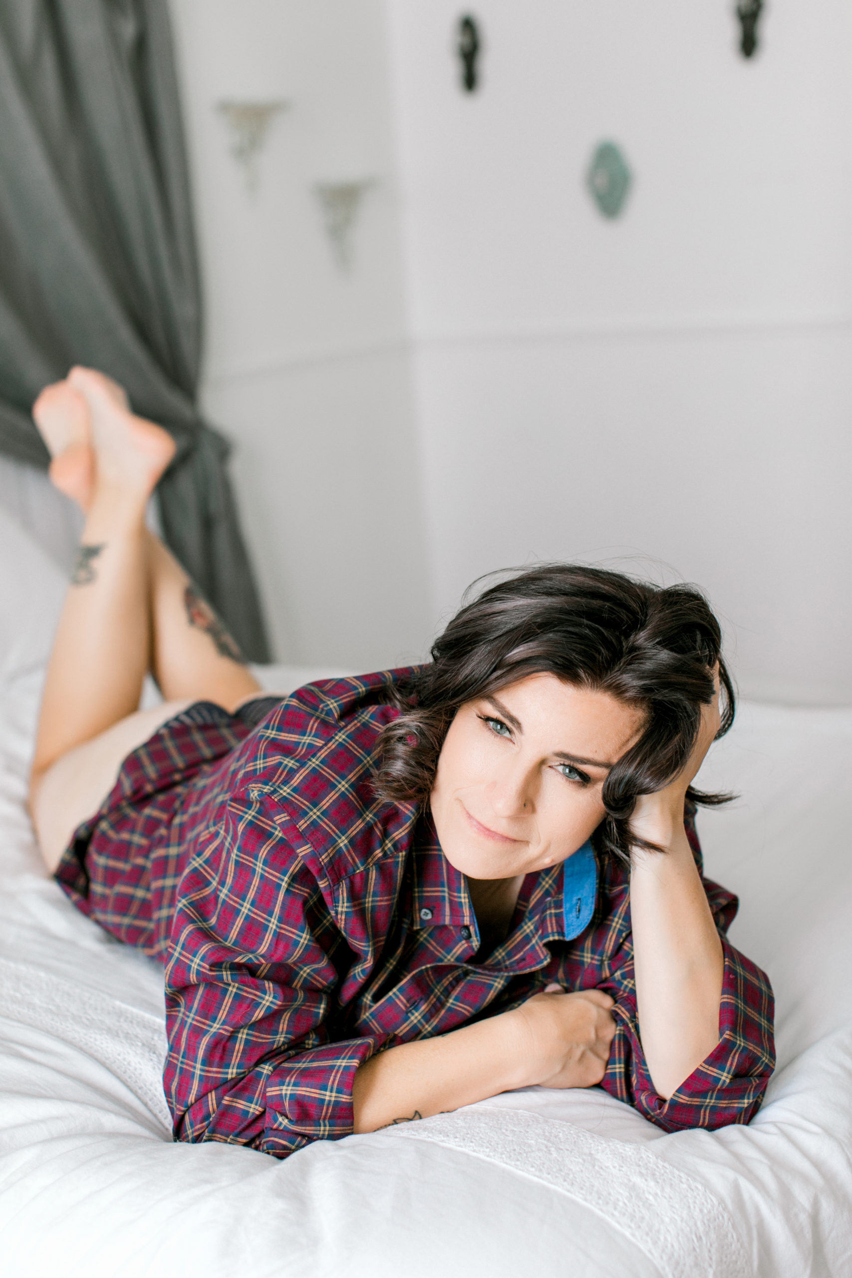 We are here to debunk five myths about boudoir photography! No it's not porn.. And yes, it's about celebrating what makes you beautiful and comfortable. Like this comfortable and sexy look wearing just his button down shirt. 