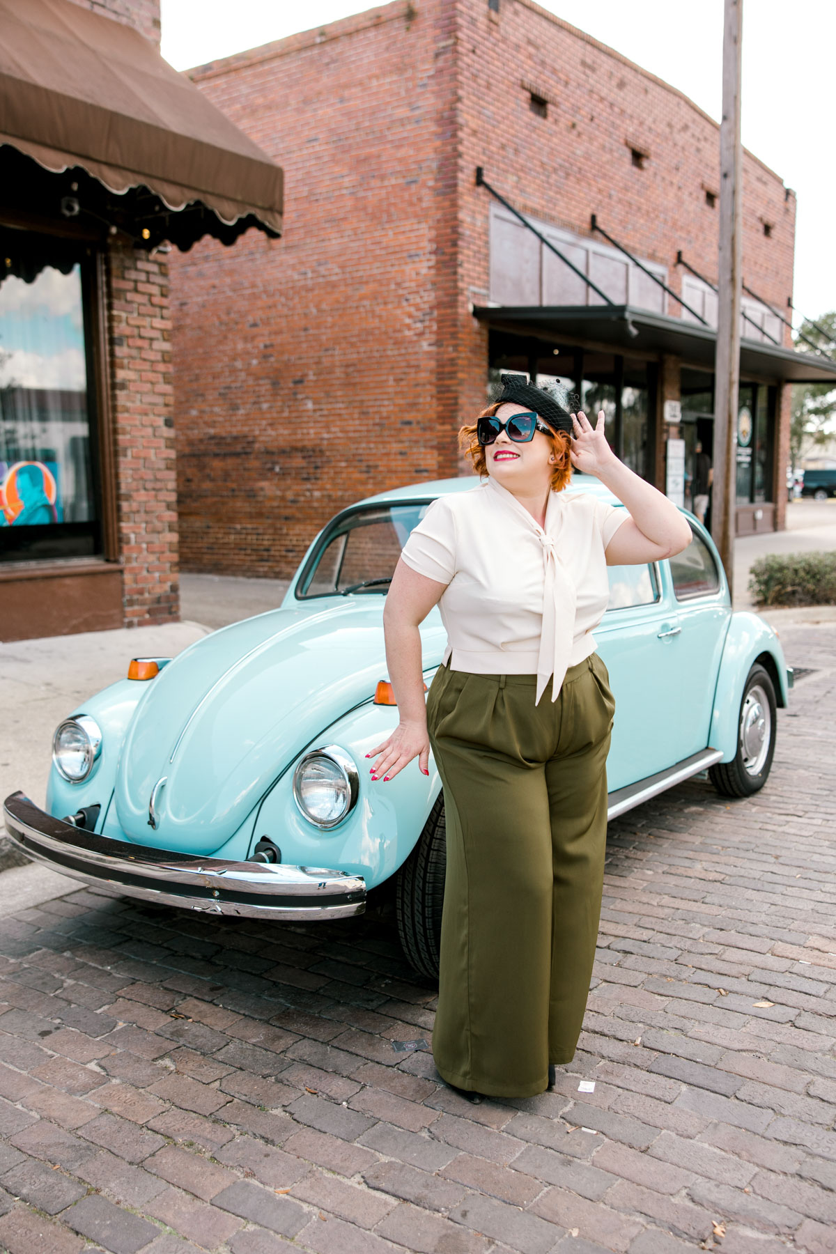Vintage car pose, wearing 1950's inspired pantsuit