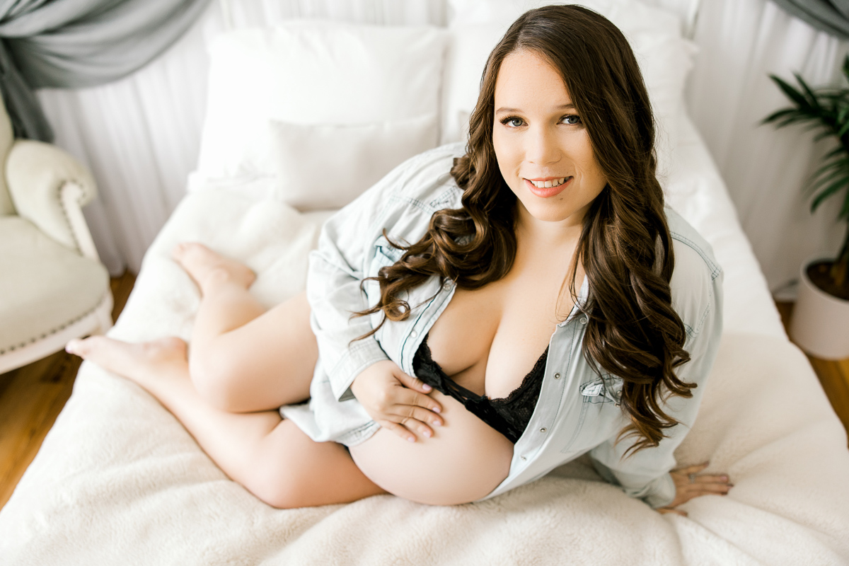 mama on bed with black lace bra and chambray