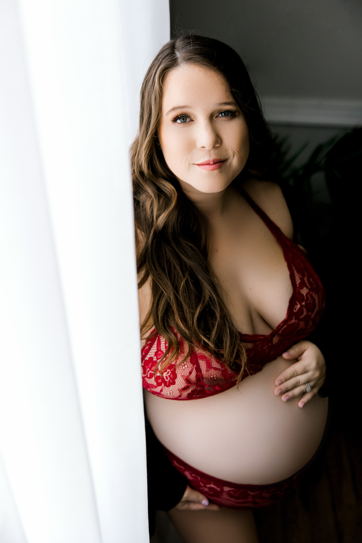 brunette mama in maroon lace bra and panty set with black cardigan sweater