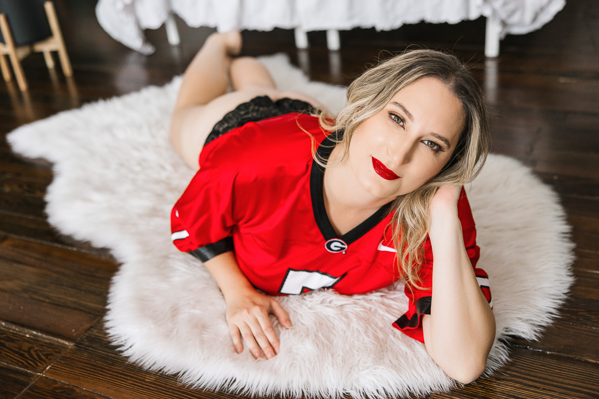 blonde in football jersey and black lace panties
